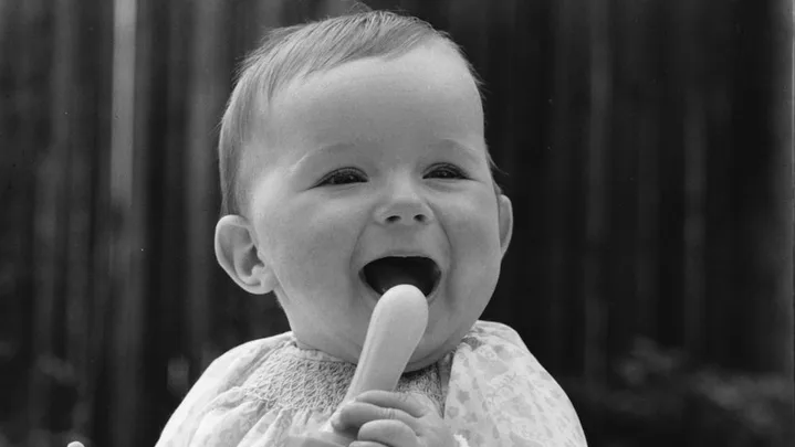 happy baby with toy