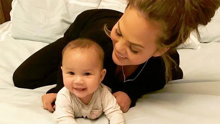 Chrissy Teigen and Luna.