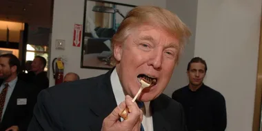 Donald Trump eating chocolate cake while bombing Syria