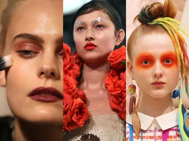 Three models showcasing bold makeup at MBFWA: warm blush, metallic brow accents with roses, and bright orange eye makeup.