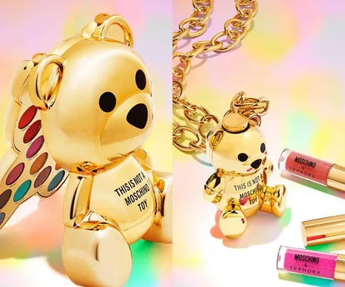 Gold bear-shaped Moschino makeup palette and necklace with Sephora lip products on a colorful background.