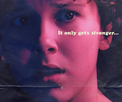 Close-up of a distressed young boy's face from "Stranger Things" with the text "It only gets stranger..." in the top-right corner.