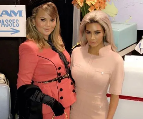 Women dressed as Pan Am flight attendants at Chrissy Teigen's birthday party.