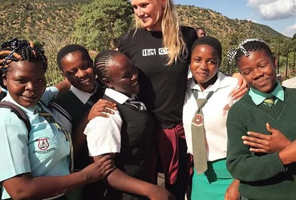 Toni Garrn with the Zimbabwean girls she is helping through the Toni Garrn Foundation and Plan International