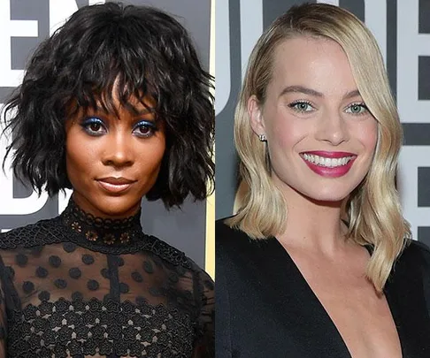 Two women at the 2018 Golden Globes: one with bold eye makeup, the other with bright lipstick, both in elegant black outfits.