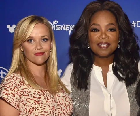 Reese Witherspoon and Oprah Winfrey at a Disney event.