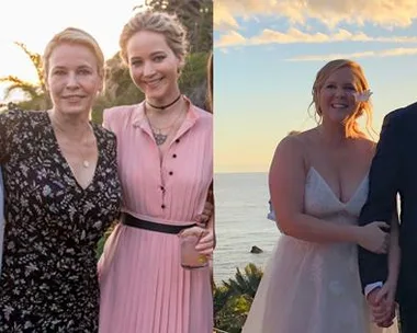 Amy Schumer at her wedding with guests on left and with her spouse on right, all smiling in an outdoor setting.