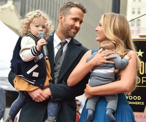 Blake Lively and Ryan Reynolds with their two children at Hollywood Walk of Fame ceremony, elder daughter holding a microphone.