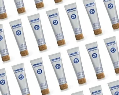 Array of Birkenstock Natural Care skincare tubes with cork lids arranged in a diagonal pattern.