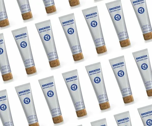 Array of Birkenstock Natural Care skincare tubes with cork lids arranged in a diagonal pattern.