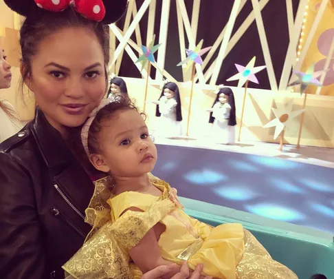 Chrissy Teigen with daughter Luna, dressed as Belle from Beauty and the Beast, at Disneyland.