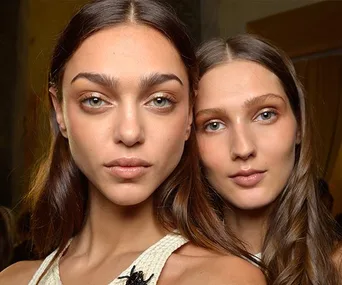 Two models with natural makeup and glowing skin, showcasing best concealer effects from Elle Beauty Team Australia.