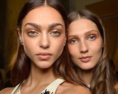 Two models with natural makeup and glowing skin, showcasing best concealer effects from Elle Beauty Team Australia.