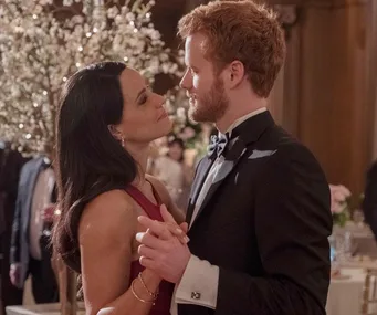 Actors portraying Meghan Markle and Prince Harry dance in a formal setting in the Lifetime movie.