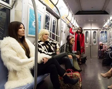 Sandra Bullock, Cate Blanchett, Rihanna, and Mindy Kaling's characters in a subway scene from Ocean's 8.