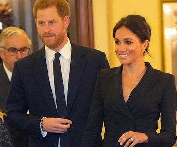 Meghan Markle Shows Off Legs In A Tuxedo Dress