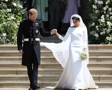 Prince Harry and Meghan Markle exiting church on their wedding day, with Meghan in a white wedding dress.