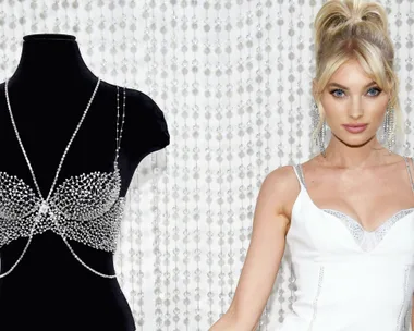 Elsa Hosk in a white dress standing next to a mannequin wearing the Victoria's Secret Fantasy Bra.