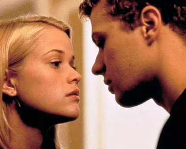 A close-up of two young people almost touching faces in an intense scene, likely from a dramatic movie.