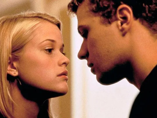 A close-up of two young people almost touching faces in an intense scene, likely from a dramatic movie.