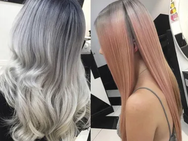 Two women showcasing pastel hair trends, one with wavy grey hair and the other with straight pastel pink hair.