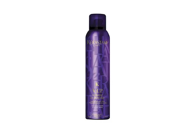 Kerastase VIP Volume In Powder, dark purple spray bottle with gold text, against white background.