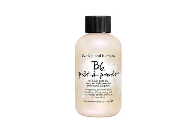 Bottle of Bumble and bumble Prêt-à-powder dry shampoo and style extender with black cap.