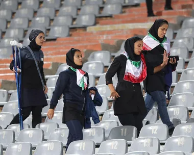 Iranian women in a football stadium.