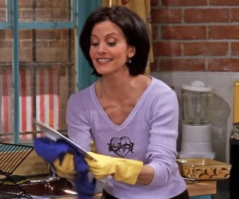 Monica from 'Friends' doing the dishes.