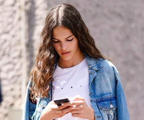 Woman looking at her phone.