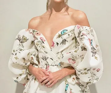 Off-shoulder floral bridal gown with puffed sleeves at New York Bridal Fashion Week 2020.