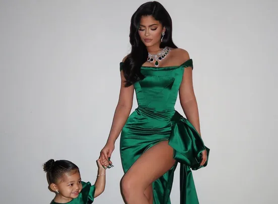 green emerald velvet dress Kylie Jenner Dark Green Off Shoulder Slit Dress Christmas Eve 2019 main image 1
