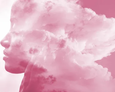 Silhouette of a person's profile merged with pink clouds, symbolizing thoughts or emotions.