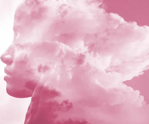 Silhouette of a person's profile merged with pink clouds, symbolizing thoughts or emotions.