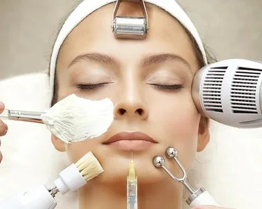 Woman receiving various beauty treatments, including facial cream, microdermabrasion, and anti-aging devices.