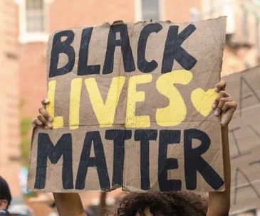 black lives matter sign at a protest