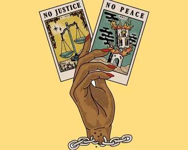 A black hand with red nails holding two tarot cards that say no justice no peace.