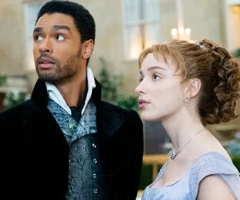 Two characters from Bridgerton dressed in Regency-era attire looking in the distance.