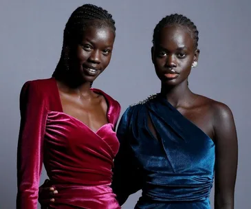 Two models in elegant velvet dresses pose for Rebecca Vallance at Australian Fashion Week 2021.