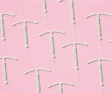 Pattern of white IUD contraceptives on a pink background.