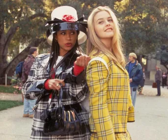 Alivia Silverstone wearing a yellow plaid suit in Clueless