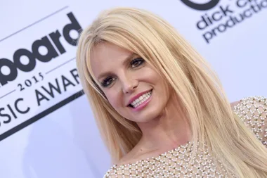 A woman with long blond hair smiling at the Billboard Music Awards.