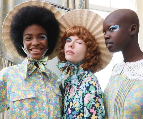 Models in floral outfits and bold makeup at London Fashion Week Spring/Summer 2022.