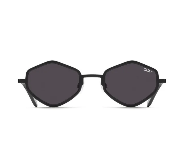 Hexagonal black-framed sunglasses with dark lenses, branded "QUAY" on upper corner.