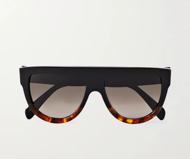 Black and tortoiseshell-accented sunglasses with flat top frame on a white background.