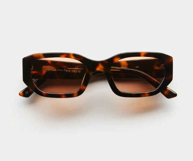 Tortoise shell sunglasses with rectangular lenses on a white background.