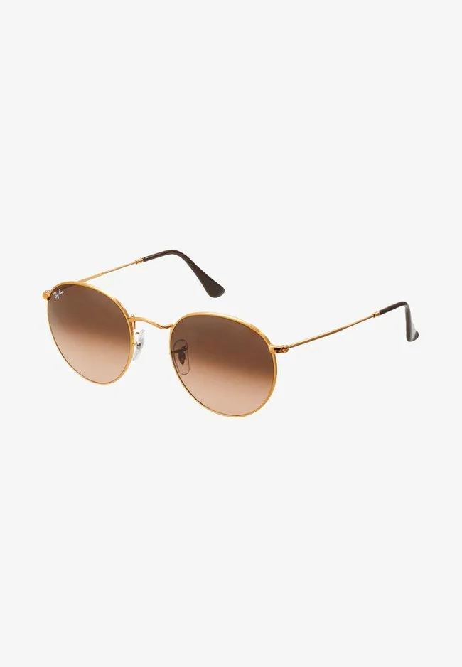 Gold-rimmed Ray-Ban sunglasses with brown gradient lenses on a white background.