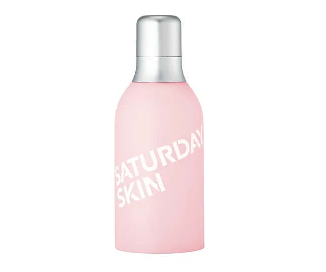 Pink bottle with silver cap labeled "Saturday Skin" on a white background.