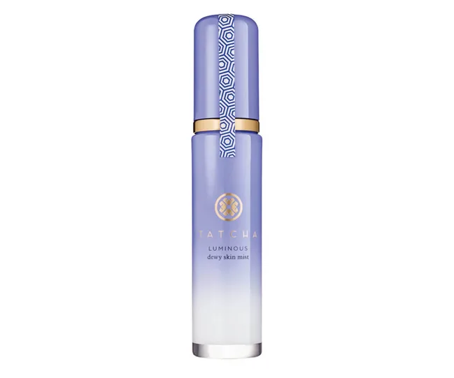 Tatcha Luminous Dewy Skin Mist bottle with gradient purple and gold accents.