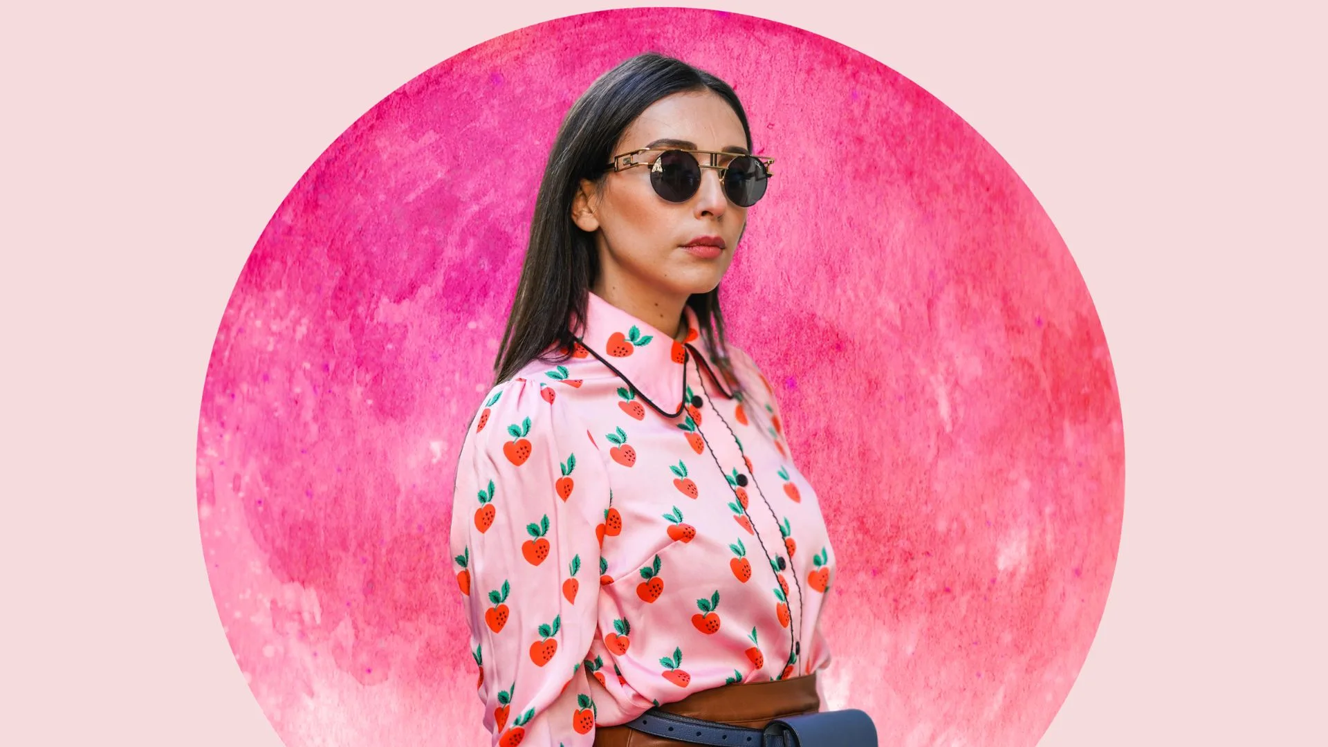woman stands in front of strawberry moon